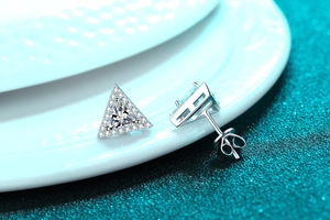 Detailed macro view of S925 sterling silver triangular moissanite stud earrings