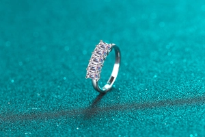 Macro shot of S925 sterling silver ring with five emerald-cut moissanite stones