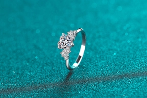 Close-up of S925 sterling silver ring featuring a heart-cut moissanite and pave diamonds