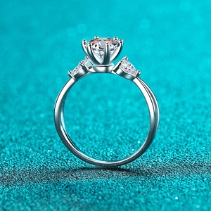 Elegant 925 sterling silver ring featuring a 1 carat round moissanite with side pear accents