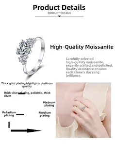 Detail view of heart-cut moissanite ring showing the multi-layer plating and side stones