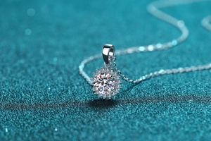 Macro detail of sunflower pendant necklace with moissanite in 925 sterling silver