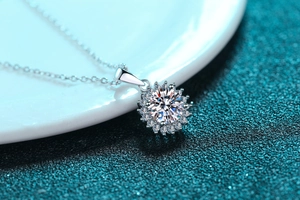 Macro shot of 925 silver sunflower necklace pendant with sparkling moissanite main stone