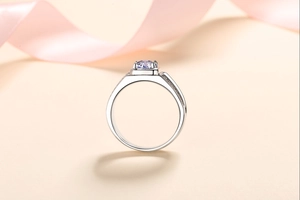 Macro shot of 925 silver ring featuring a lavender moissanite stone and silk ribbon