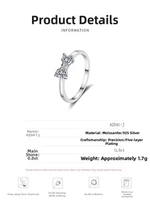 Detail of 925 sterling silver bow ring featuring two 0.8ct heart-cut moissanite stones