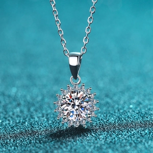 925 sterling silver sunflower necklace with sparkling moissanite on blue background