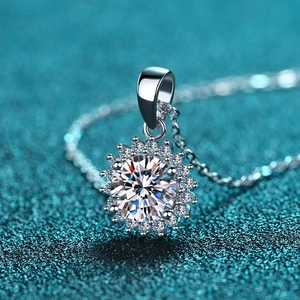 925 silver sunflower pendant necklace with moissanite center stone on teal background