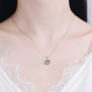Elegant 925 sterling silver necklace featuring a sunflower moissanite pendant on a model