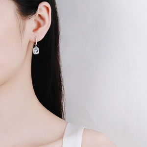 Elegant S925 sterling silver hoop earrings with radiant cut emerald-style stone for women