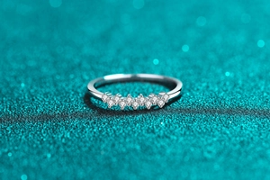 Macro shot of 925 sterling silver ring with delicate row of moissanite stones