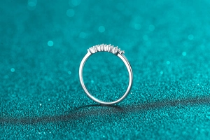 Macro detail of S925 sterling silver ring featuring sparkling small round-cut Moissanite stones