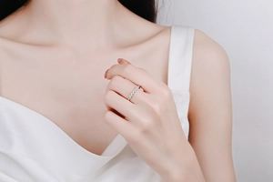 Close-up of elegant S925 sterling silver ring with five sparkling moissanite stones