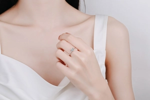 Classic silver S925 sterling silver ring with sparkling heart moissanite worn on finger