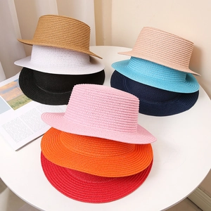 Unisex summer straw hats in various colors with flat top design for sun protection