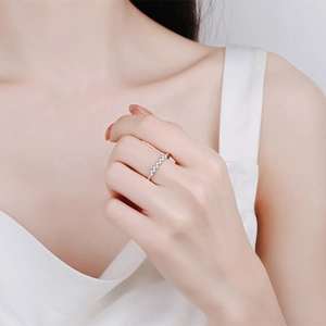 Elegant S925 sterling silver moissanite row ring with polished finish on model's hand