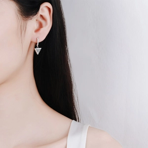 Elegant S925 sterling silver triangle drop earrings with moissanite on female model