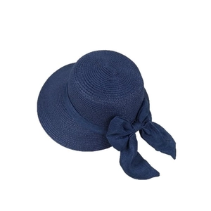 Navy blue woven sun hat with a large bow detail and minimalist French flat top style
