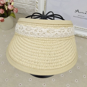 Children's beige straw sun visor with white lace bow decoration and open-top design