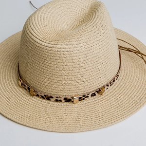 Light beige straw sun hat with leopard print band and gold star metal rivet accents