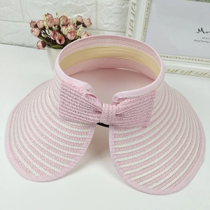 Summer open top straw sun hat with pink stripes and large bow decoration for travel
