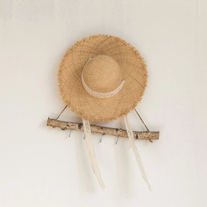 Women's summer raffia straw hat with white lace ribbon and frayed brim detail