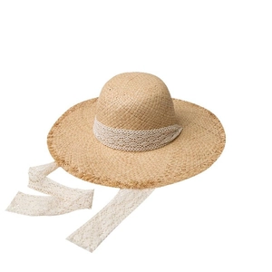 Summer raffia straw sun hat for women with elegant white lace ribbon and frayed edges