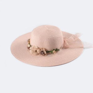 Summer foldable pink wide-brim straw sun hat with floral ornaments and ribbon