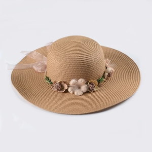 Women's foldable straw sun hat with large brim and handmade floral ribbon decor