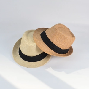 Detail of woven straw fedora hats in beige and khaki with black decorative bands