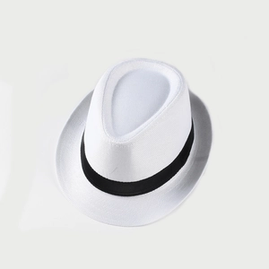 Detail of white breathable woven fedora with black ribbon band for beach vacation
