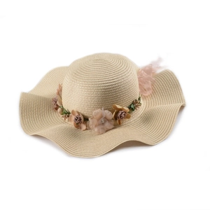 Elegant beige wide brim straw hat with artificial rose floral wreath for sun protection