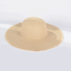 Beige wide-brim straw sun hat with frayed fringe edges for summer beach vacations