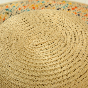 Macro shot showing the intricate texture of natural straw fiber and colorful weaving detail