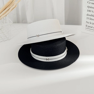 Elegant wide brim flat top straw hat for women with black and white ribbon and M metal buckle