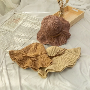 Handwoven sun hat with scalloped edges in three colors for beach vacation sun protection