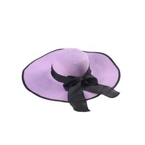 Summer lavender straw hat with wide brim, black ribbon bow, and UV sun protection