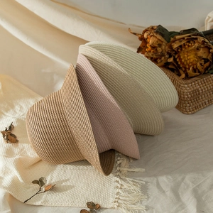 Foldable straw sun hat for girls in brown, pink and beige with fine woven texture