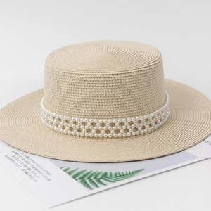 Elegant beige straw boater hat featuring three rows of decorative white pearls on the band