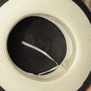 Detailed macro view showing the adjustable drawstring and woven texture of the sun hat