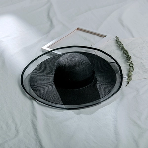Foldable black mesh wide brim sun hat for women with elegant UV protection design