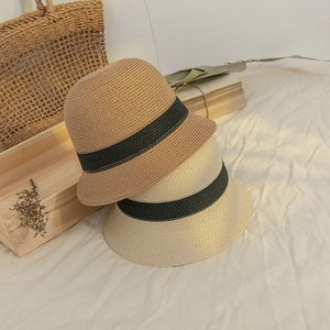 Japanese style woven straw bucket hat with black ribbon trim for sun protection
