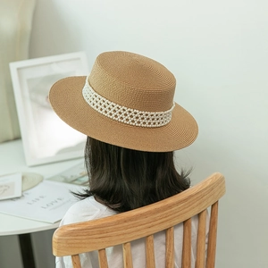 Elegant straw boater hat with pearl band shown from back view for sun protection