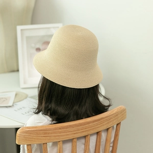 Japanese style woven beige bucket hat for women with minimalist spiral sun protection texture