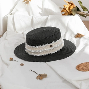 Elegant black straw boater hat with cream fringe trim and gold letter M detail