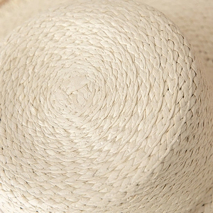 Detailed macro view showing intricate spiral hand-woven natural straw fiber texture