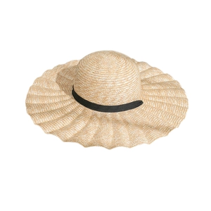 Women's wide-brim straw sun hat with wavy edges and a decorative black ribbon band