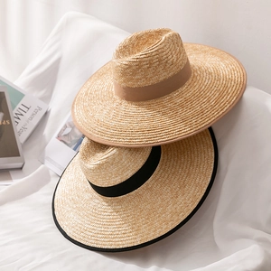 Straw Panama hats for men and women featuring decorative bands for summer beach outings