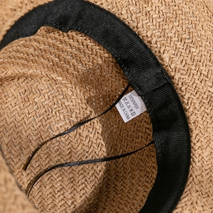 Close-up of internal sweatband and 100% paper weave detail on sun hat