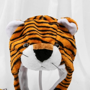 Detailed view of plush tiger hat with soft faux fur textures and classic orange stripes