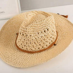 Detail of hand-woven straw hat showing breathable hollow-out texture and stylish rope band